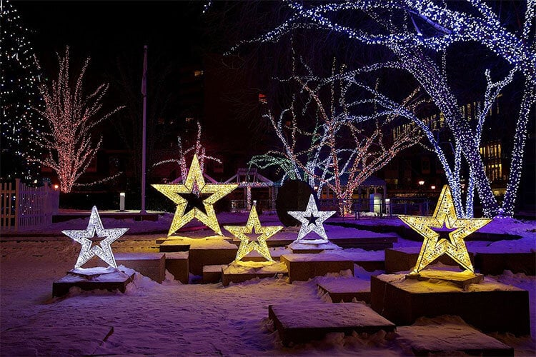Outdoor Christmas festival park featuring illuminated commercial holiday decorations